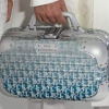 Dior và Rimowa hợp tác cho ra bộ sưu tập phụ kiện du lịch sành điệu