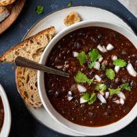 smoky-black-bean-soup-in-2-bowls-with-bread.jpg