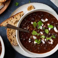 smoky-black-bean-soup-in-2-bowls-with-bread.jpg