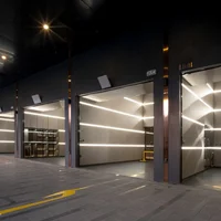 Khu garage xe siêu sang bao gồm 10 chỗ đậu xe với nội thất cao cấp, trạm sạc xe điện và cửa cuốn nhìn xuyên thấu.