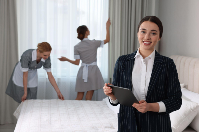 estate-manager-with-tablet-checking-maids-work-in-bedroom-1535.jpg